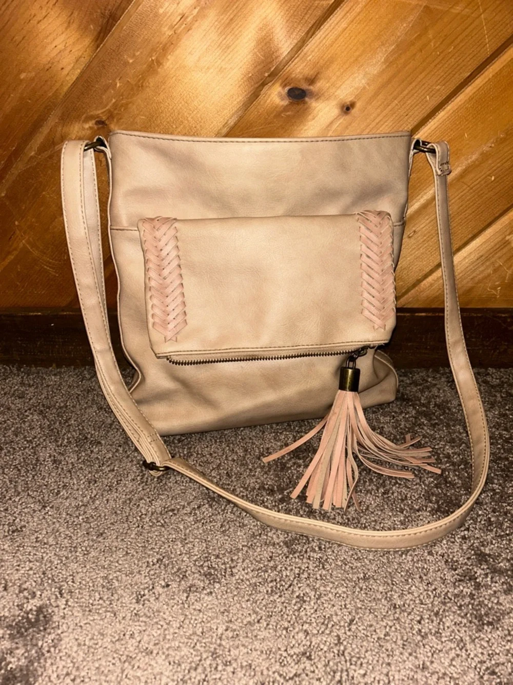 Western style tan crossbody bag with braided & tassels accents